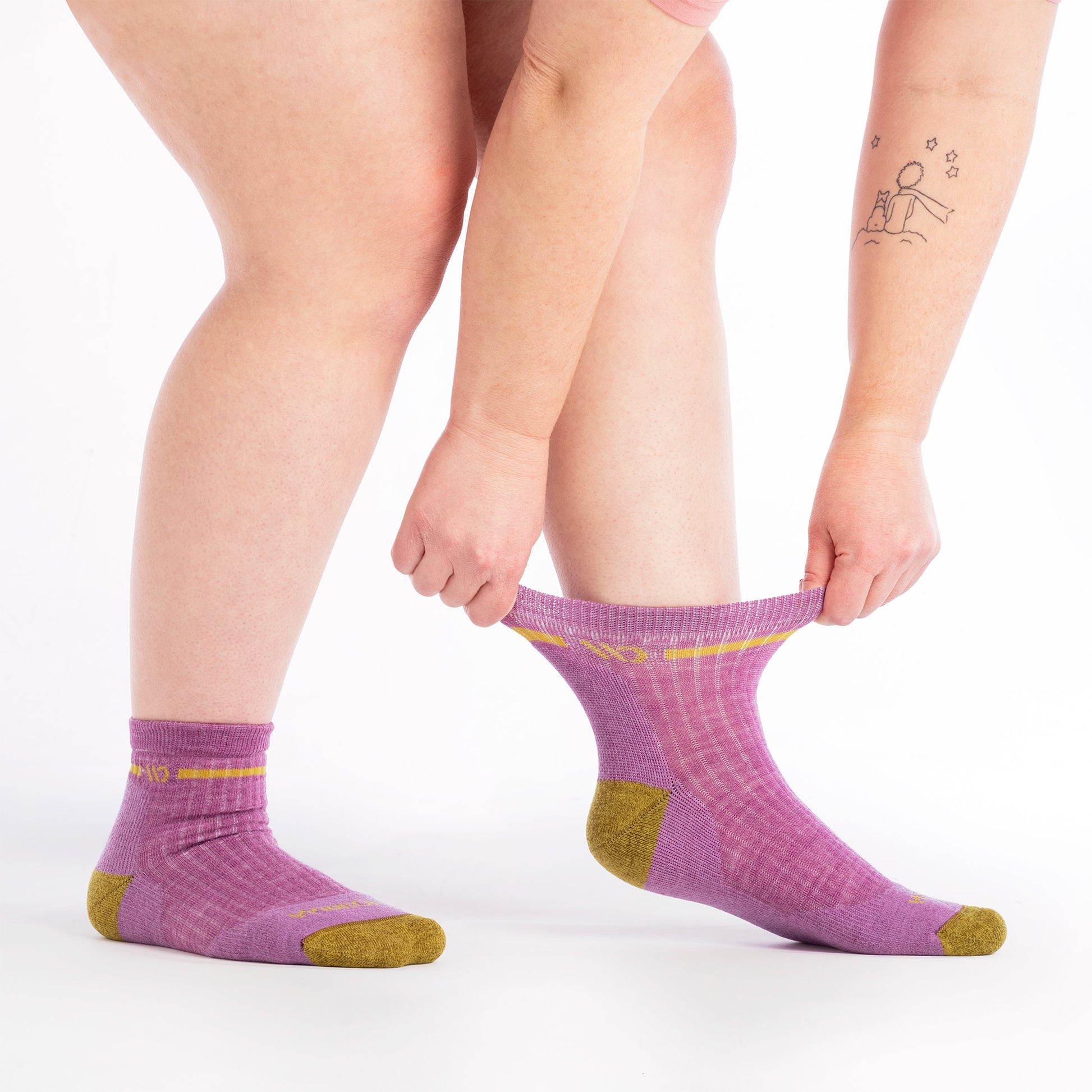 on model image of model stretching the top cuff of the 9501 single stripe 1/4 sock in violet