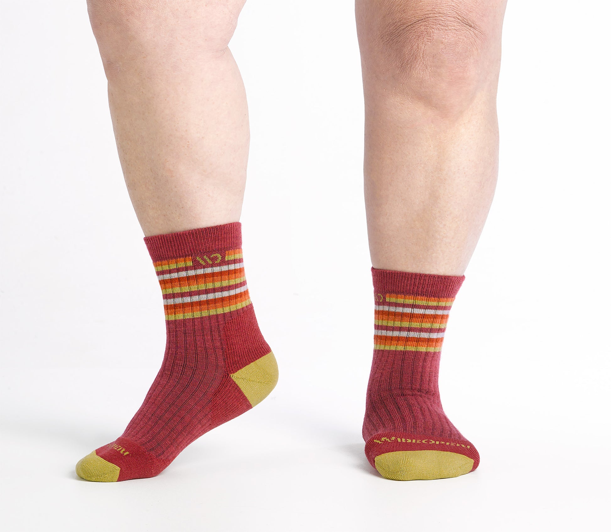 one foot to the side Micro Crew on body with Yellow heel/toe, cranberry body and Stripes below the cuff 