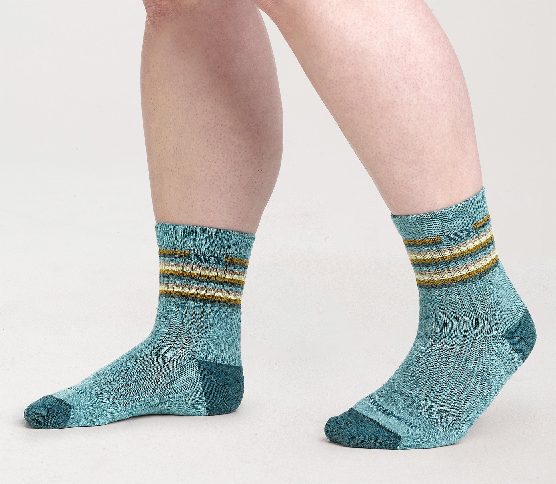 On model Micro Crews: dark teal toe, light teal body and stripes below cuff --Light Teal