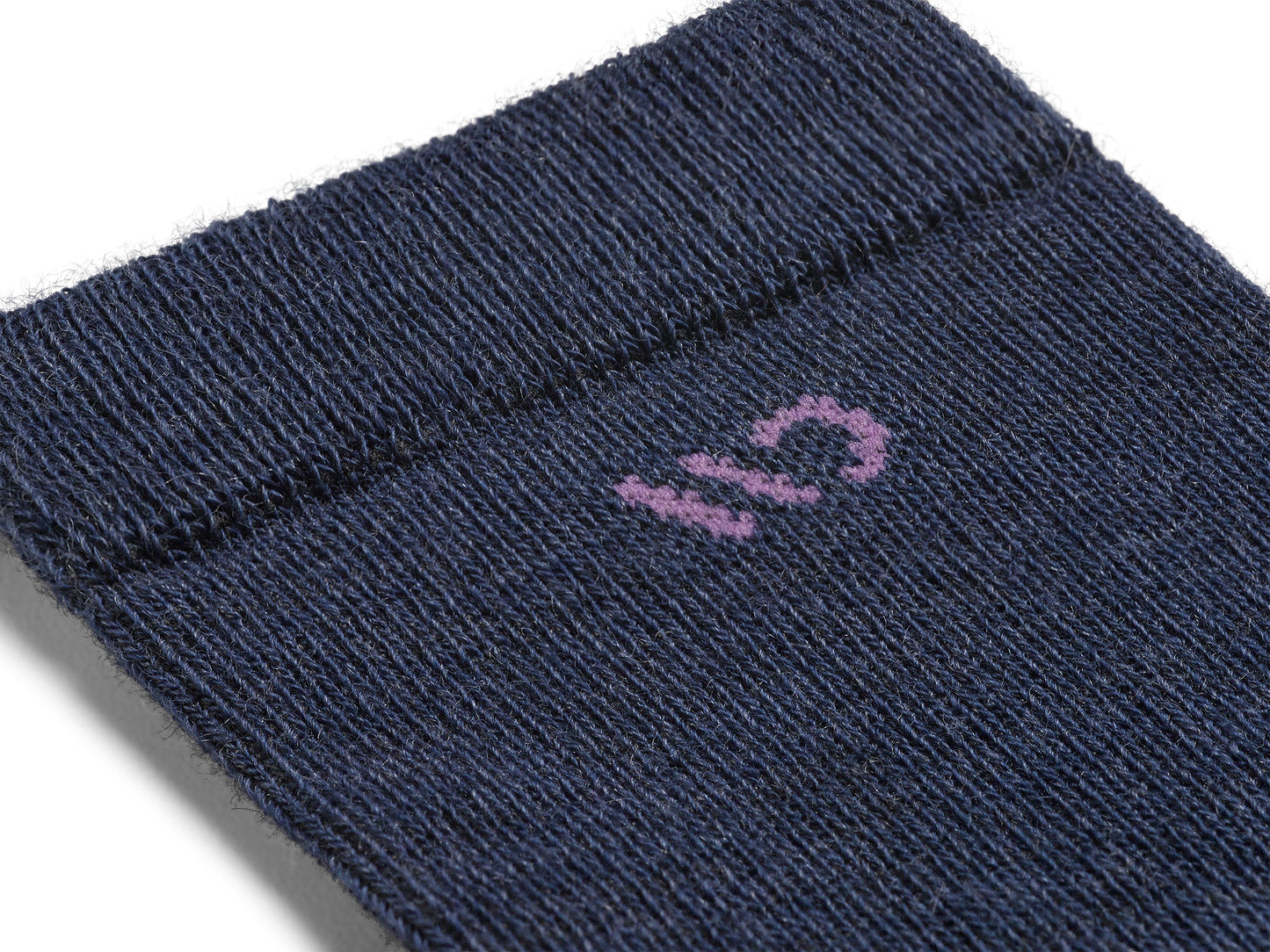 Detail featuring a pink logo and denim body 