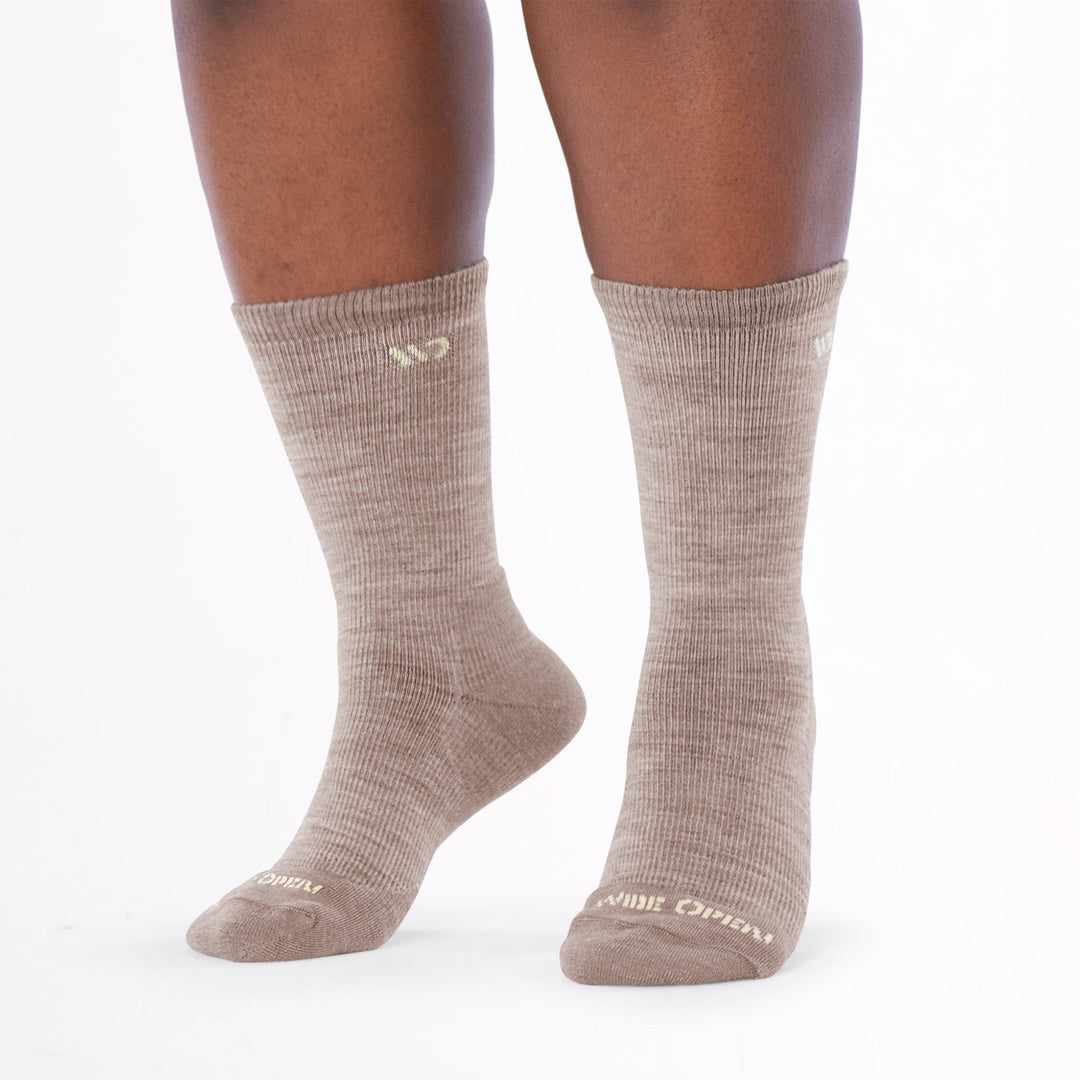 Model image standing on toes wearing the 9504 IN rye colorway