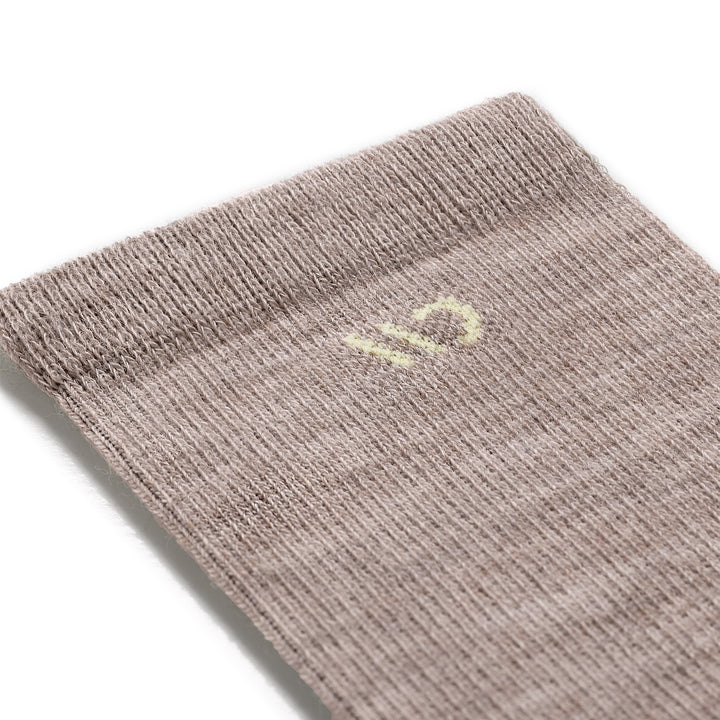 close up detail image of the 9504 rye colorway with cream color logo