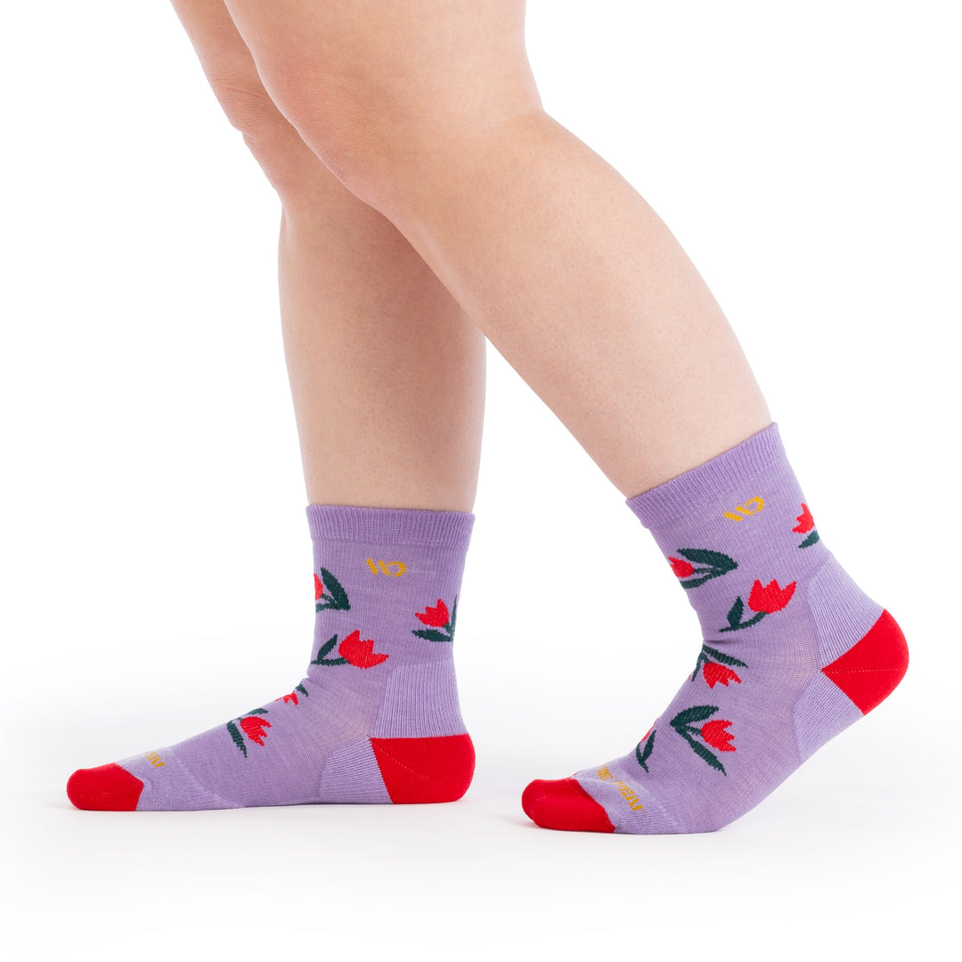 on model image with feet walking to the side wearing the 9507 full bloom micro crew in Tulip purple