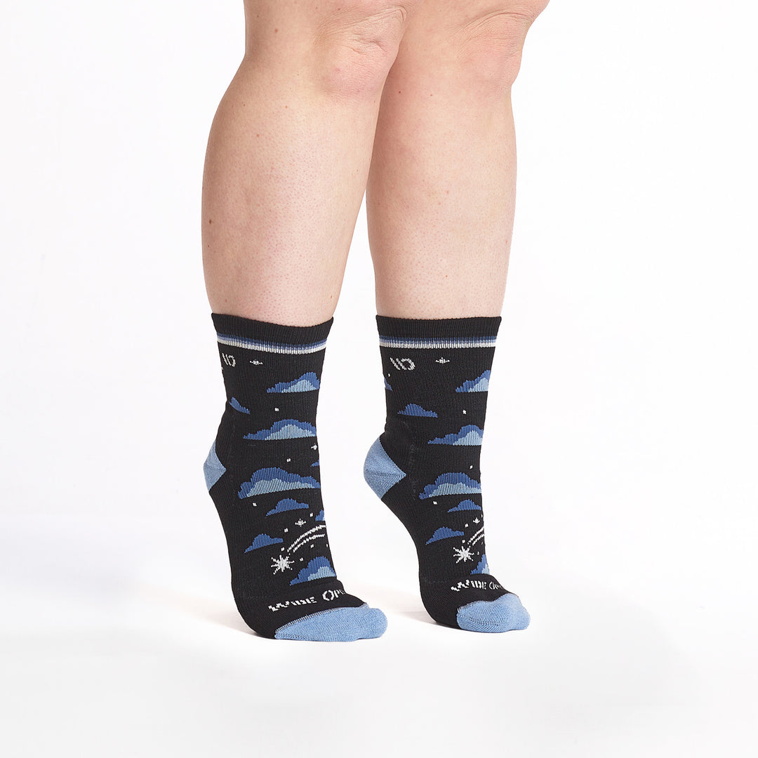 9508 black micro crew sock with light blue heel/toe, white logo, black body and blue clouds all over and shooting stars