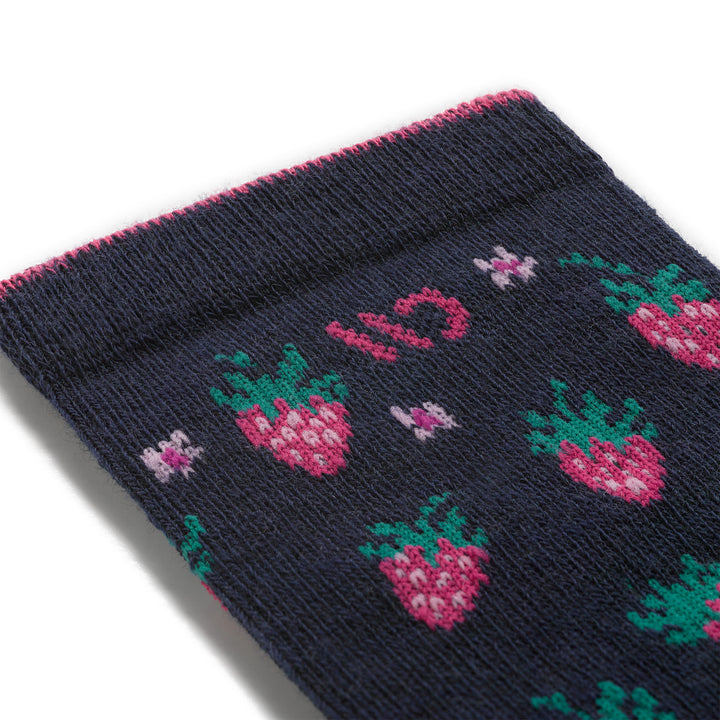 close up detail swatch of the strawberry fields cushioned crew featuring strawberries all over design