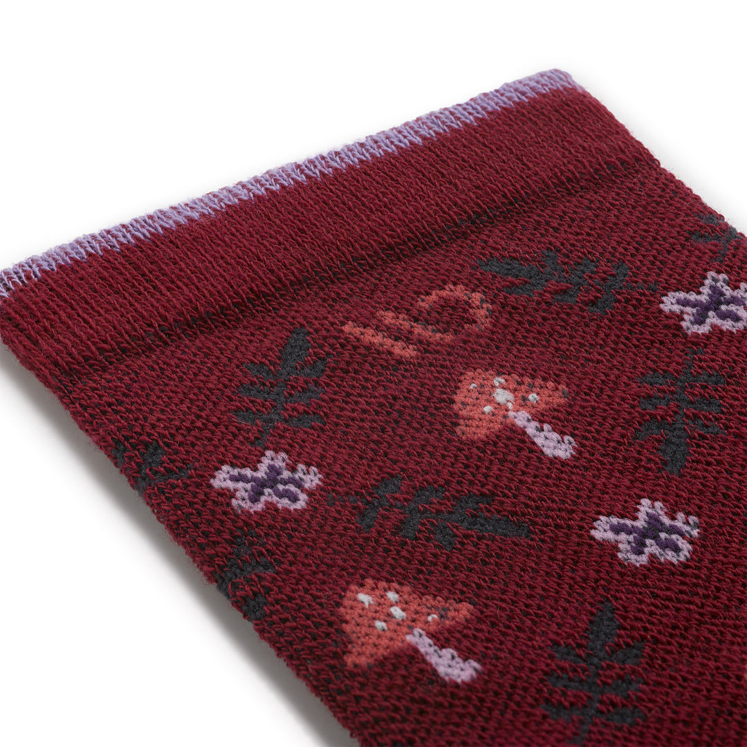 close up detail image of the 9512 wildwood cushioned crew in burgundy featuring mushrooms and ferns