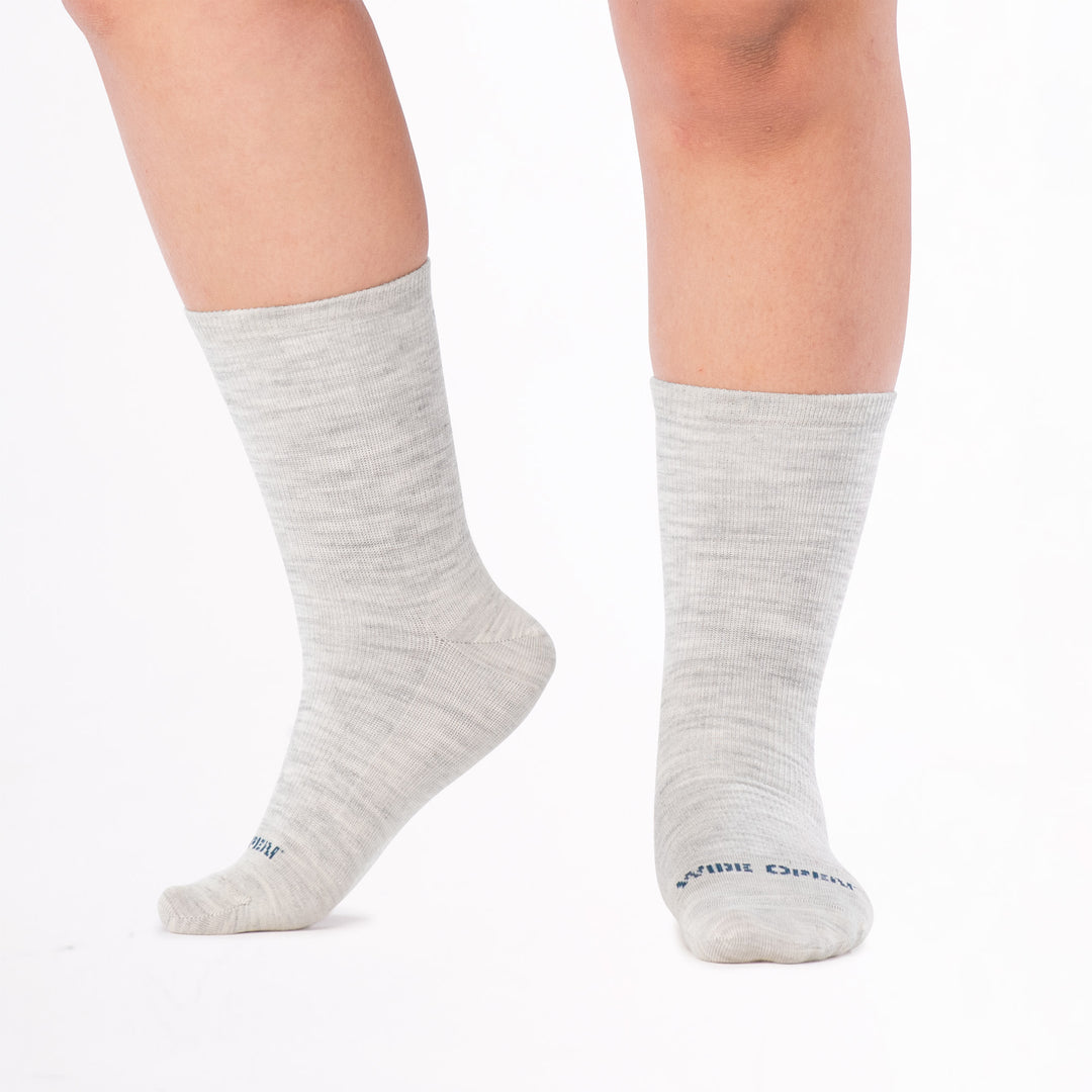 models feet with left foot raised wearing the 9513 solid basic lightweight crew in ash