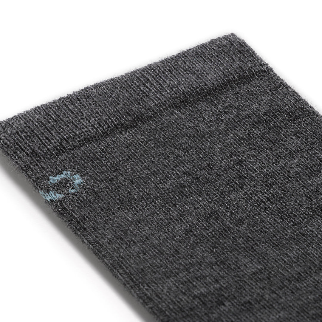 close up detail image of the 9513 solid basic lightweight crew in gray featuring a light blue logo on gray body