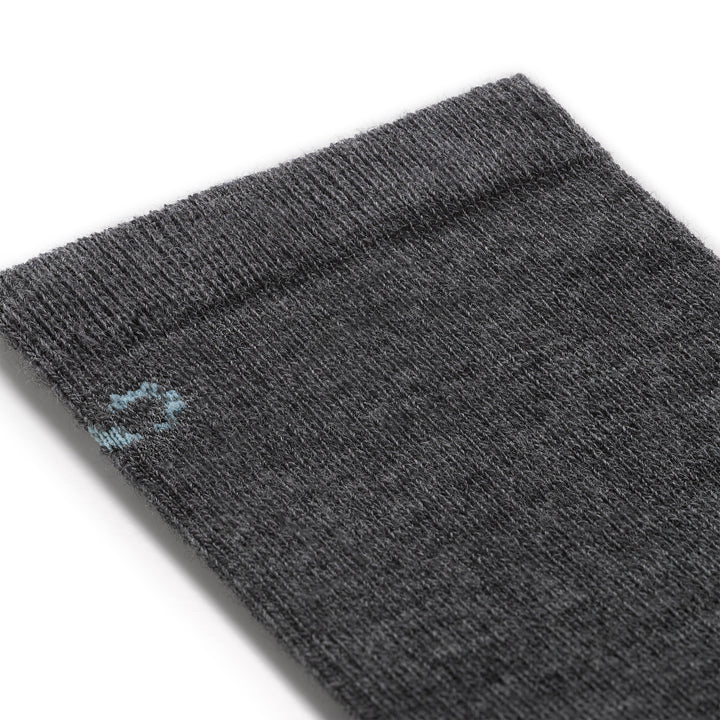 close up detail image of the 9513 solid basic lightweight crew in gray featuring a light blue logo on gray body