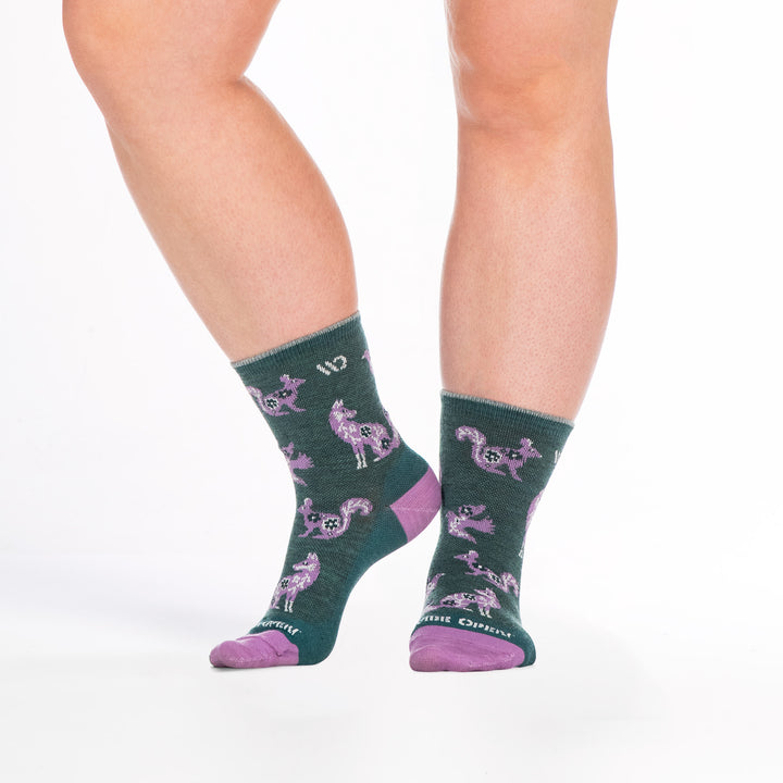 9516 teal micro crew sock with purple heel/toe, white logo, shown from front and side left foot raised 