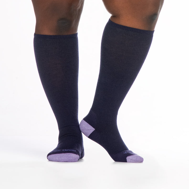 9517 blackberry knee high sock with lavender toe/heel/logo, shown from and side with right heel raised