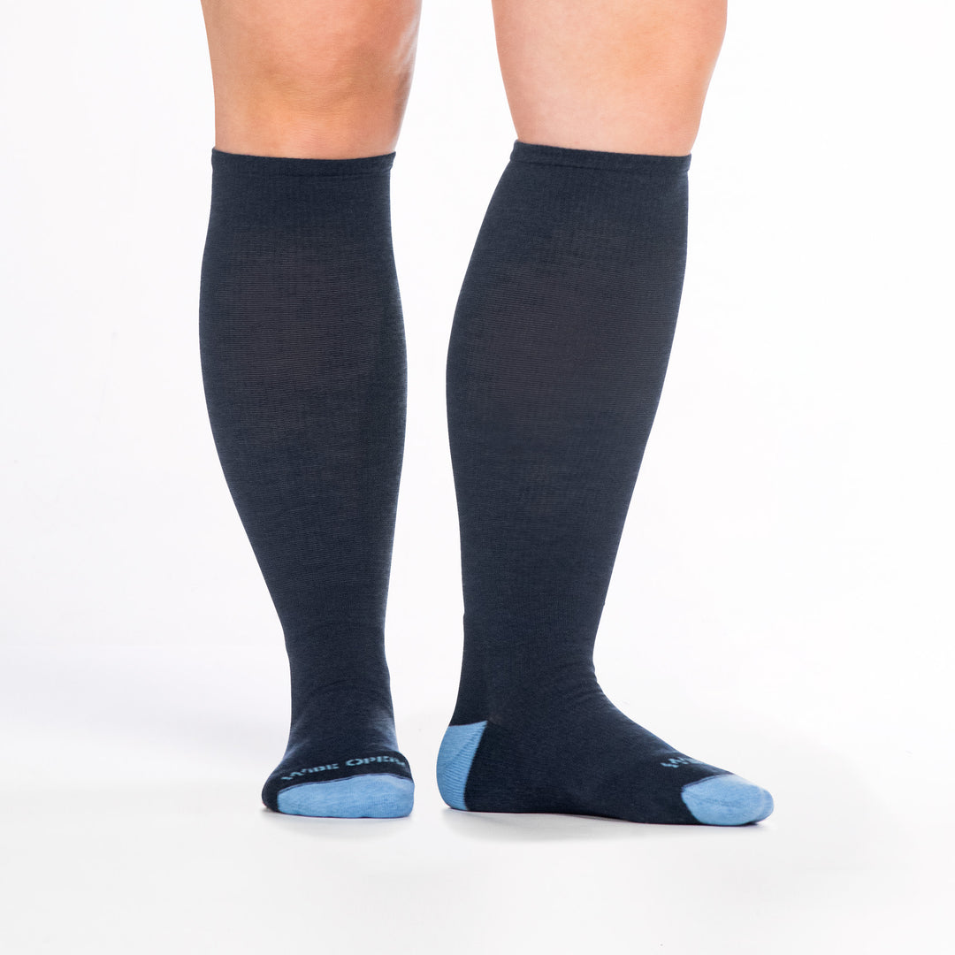 9517 denim knee high sock with light blue heel/toe/logo, shown from front and side with right foot to the side