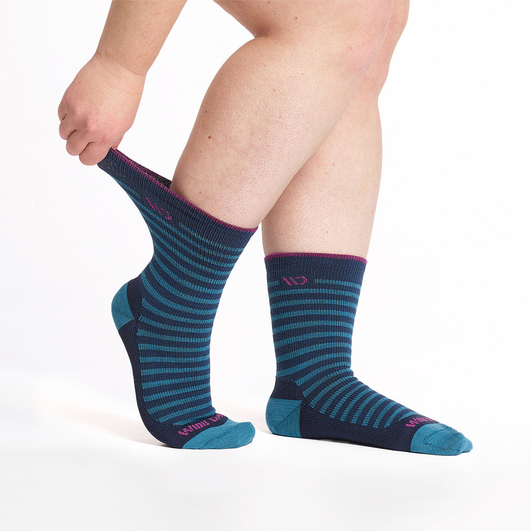 9518 Navy crew sock with teal stripes, teal heel/toe, and magenta logo cuff trim, Side image with stretched cuff