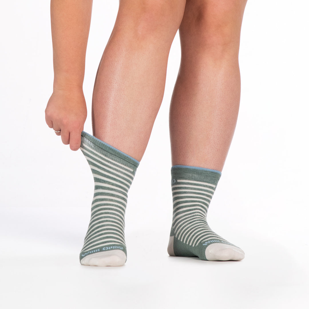 9518 seafoam micro crew sock with white heel/toe/stripes, blue logo, shown from the front left cuff being stretched