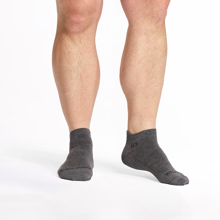 models feet facing forward wearing the 9013 lightweight ankle sock in gray 
