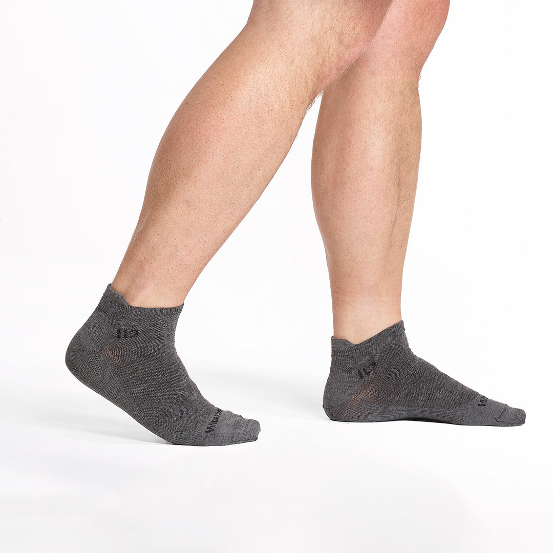 models feet walking to the right wearing the 9013 lightweight ankle in gray 