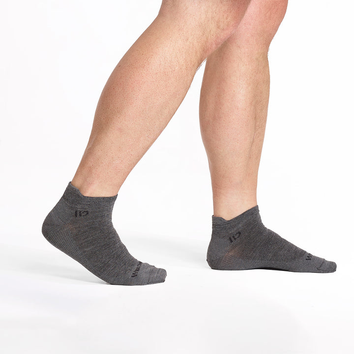 models feet walking to the right wearing the 9013 lightweight ankle in gray 