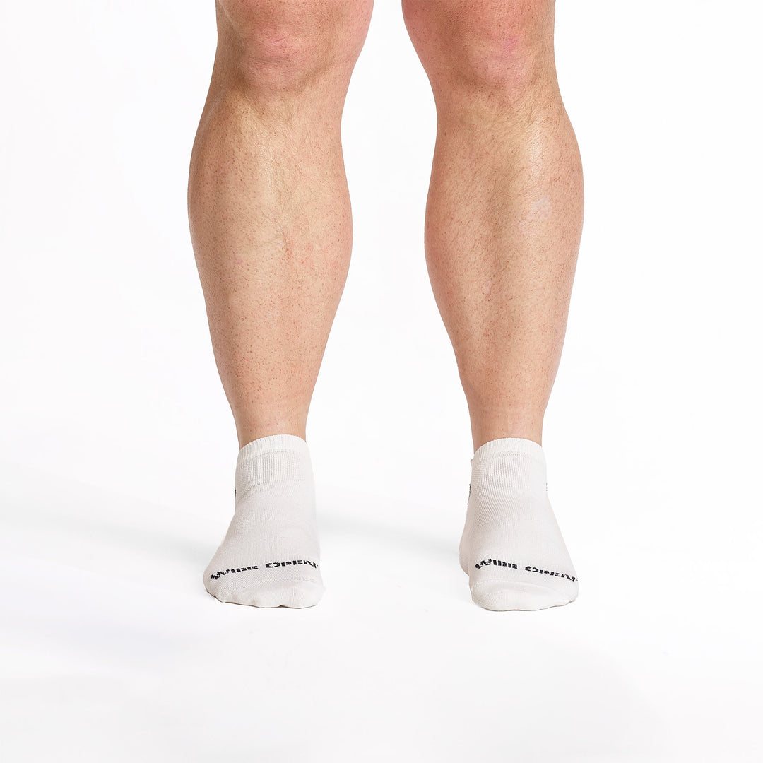 Models feet facing forward wearing the 9013 lightweight ankle sock in white 