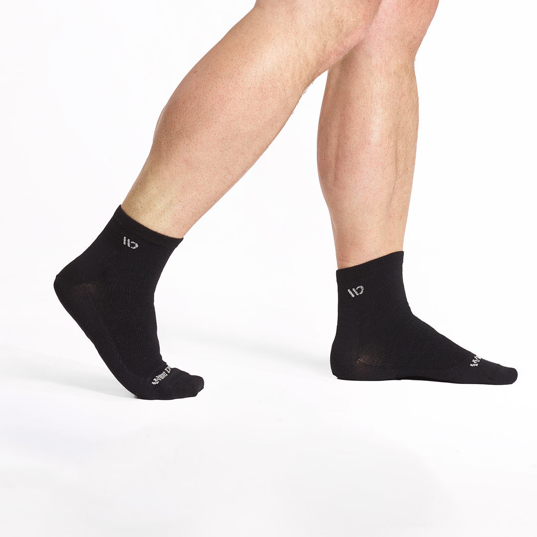 Model walking to the right wearing the 9014 lightweight quarter in black 