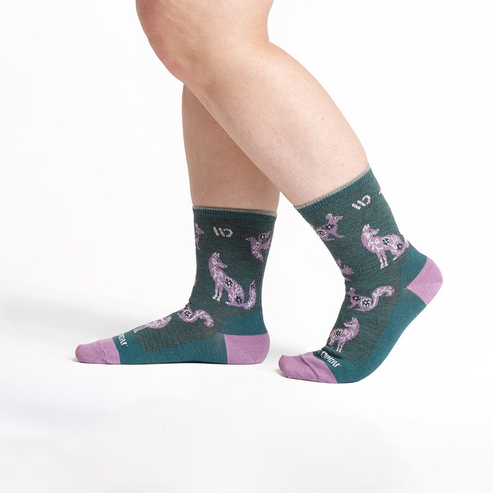 models feet walking to the left wearig the 9516 woodland wonder micro crew in teal 