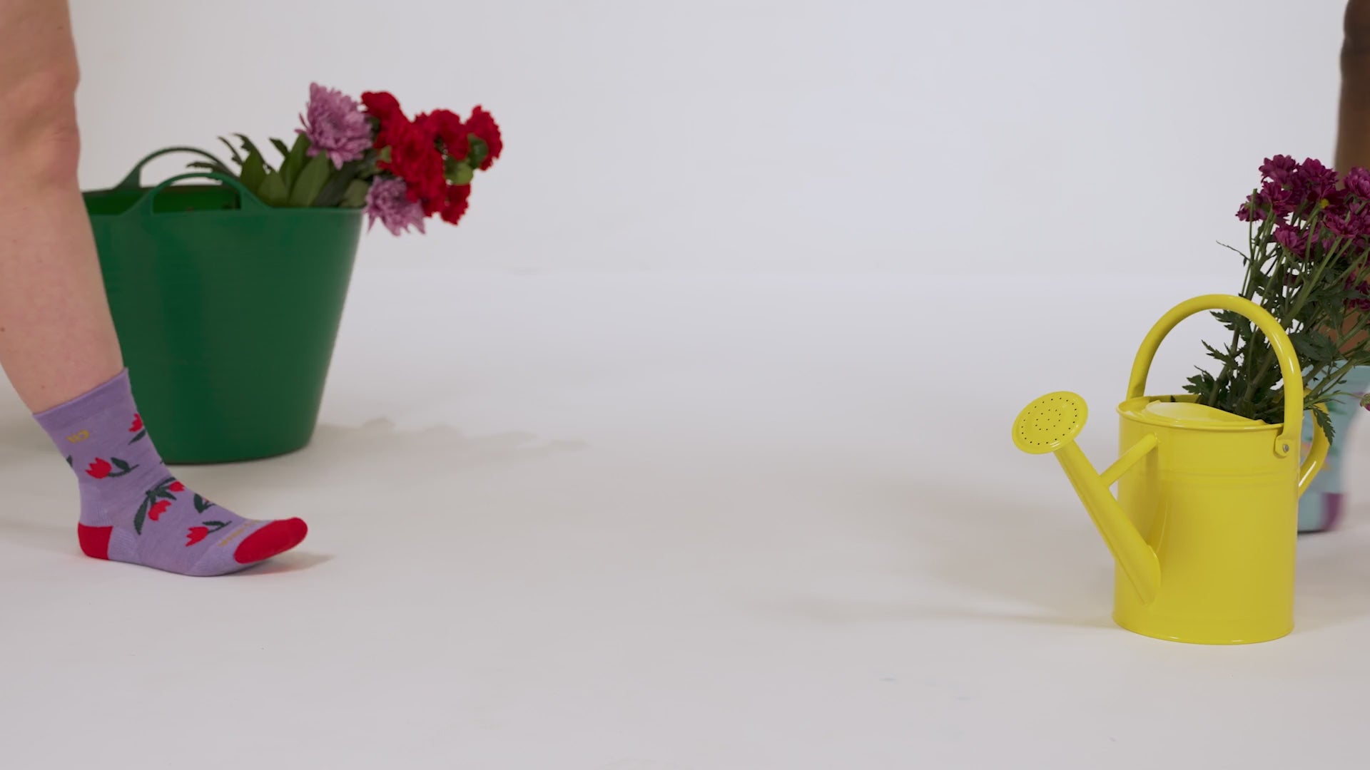 video of two models walking in in both full bloom colorways stretching the cuff